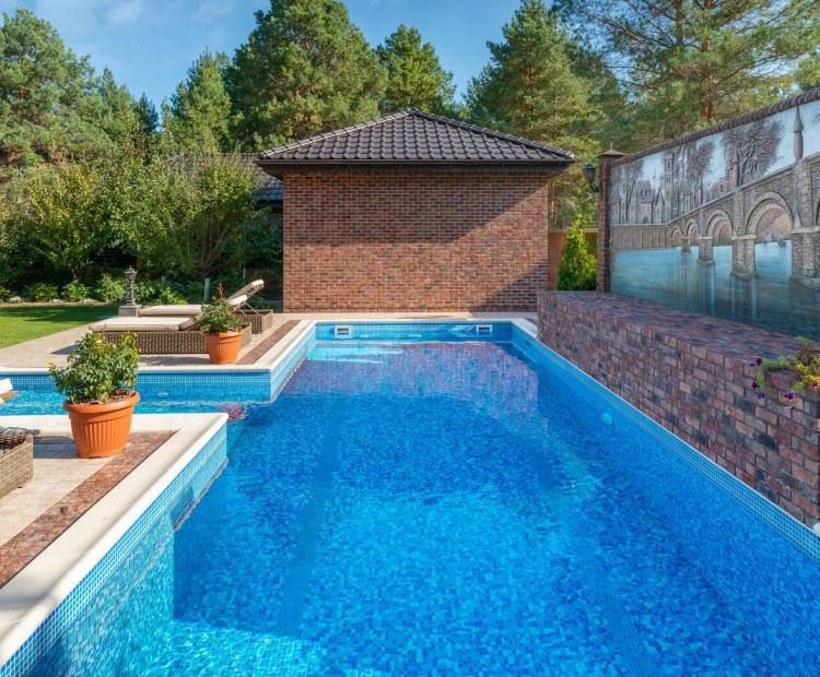 Residential swimming pool beside an outdoor living area